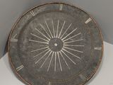 a plate that has a clock on it in a corner