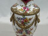 a vase that is sitting on a white surface