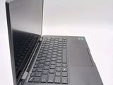 a laptop computer that is open on a white surface