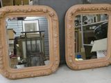 two mirrors that are sitting on top of a table