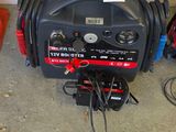 an image of a portable generator in the corner of a room