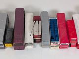 a lot of different colors of ink cartridges in a row