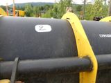 a close up of a yellow and black machine with a number 2 on it
