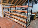 many shelves that are in a room with a lot of shelves