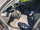 the interior of a car with the door open and the driver seat down