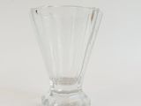 a glass vase that is sitting on a table