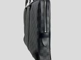 a black briefcase with a zipper on top of it