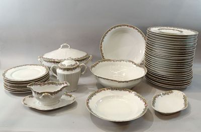a lot of plates and bowls that are on the table