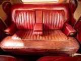 a red leather seat in the back of a car