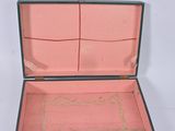 an open suitcase with a pink lining on the inside of it