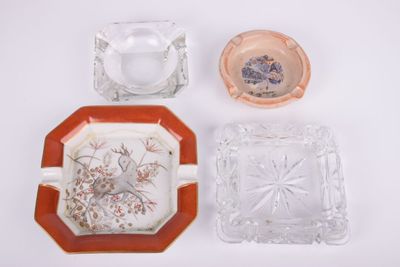 three glass ashtrays and a glass ashtray on a white surface