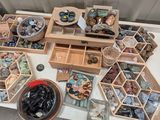 a table with a lot of rocks and other items on it