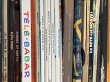 many books that are in a box on the table