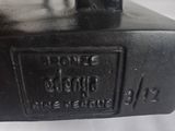 a close up of an old sewing machine on a white surface