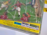 toy figurines of soccer players in action in a plastic case