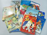 many children ' s books that are on the table