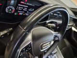 a steering wheel and dashboard of a car in a showroom