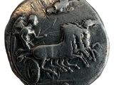 une image représentant une pièce de monnaie sur laquelle figurent un cheval et une calèche