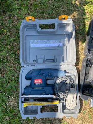 two tools in the case on the grass