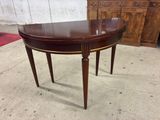 an image of a wooden table with a curved top