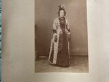an old photo of a woman in a fur coat