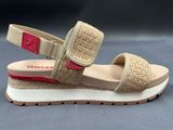 beige and red sandals with two straps on a gray surface