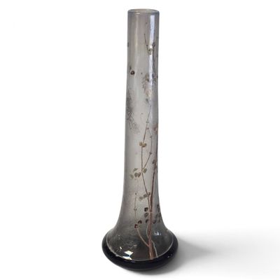 a glass vase that is sitting on a table