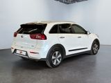 the rear end of a white suv parked in a showroom