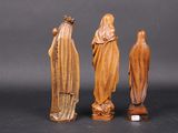 three carved wooden statues of jesus and mary