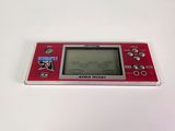 an image of a red gameboy sitting on top of a white table