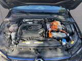 the engine of a car with its hood open on the street
