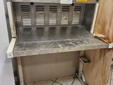 an image of a kitchen with a sink and a refrigerator