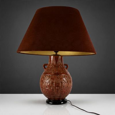 an image of a lamp with a brown shade on a table