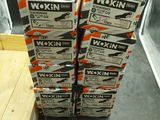 several boxes of workin are stacked on top of each other on the floor