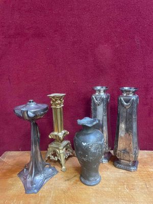 four different types of vases sitting on a table