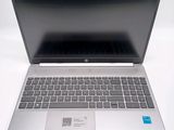 a laptop computer that is sitting on a white surface