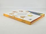 a stack of children ' s books sitting on a white surface