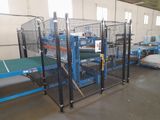 an image of a factory with a large caged in area