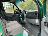 the interior of a green truck with the door open