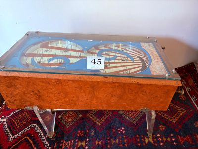 a table with a glass top that has a picture on it