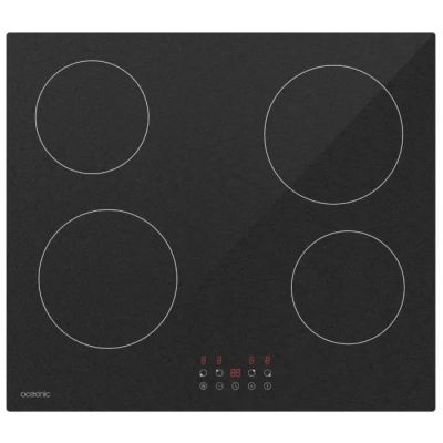 gros plan d'une cuisinière noire à quatre brûleurs