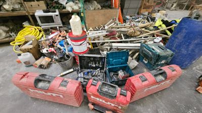 a pile of junk on the ground in a garage