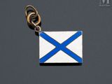 a silver and blue scottish flag charm on a black background