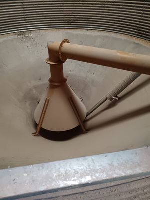 a sink that has a metal faucet in it