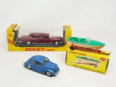 two toy cars and a boat in a box