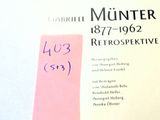 a book with a pink sticker on it that has a picture of a woman ' s name on it