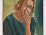 portrait of a woman in a green dress with her chin resting her hand on her chin