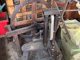 a small machine that is sitting in a garage