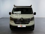 the front view of a white van parked in a showroom