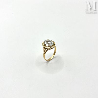 a close up of a diamond ring on a white surface